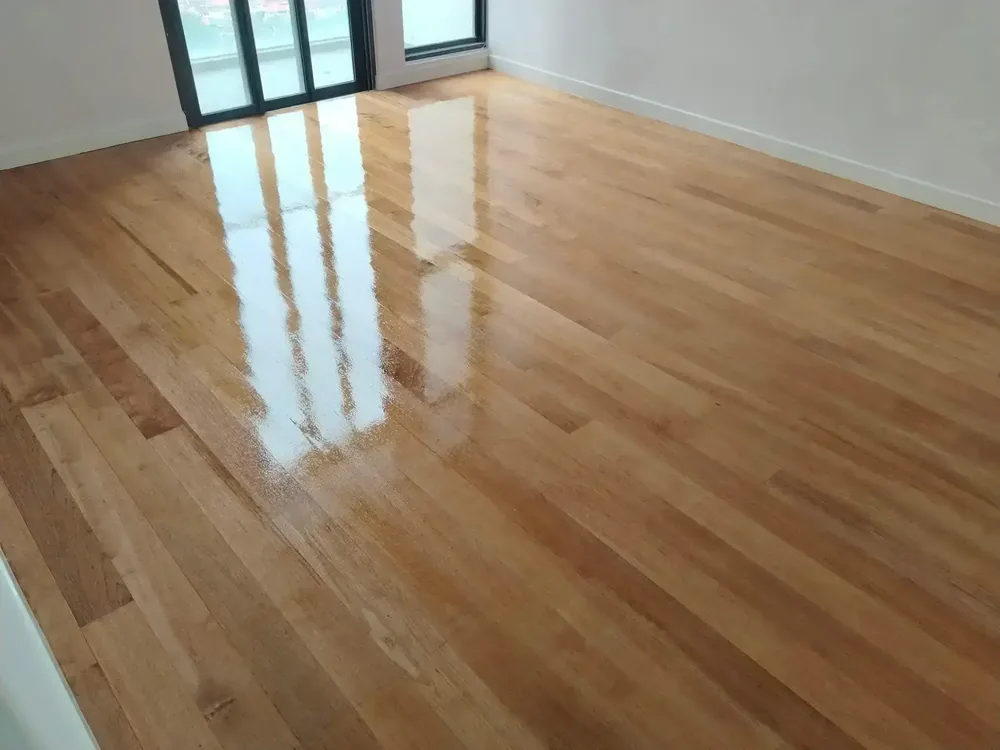Honey-toned hardwood floor after polishing and varnishing