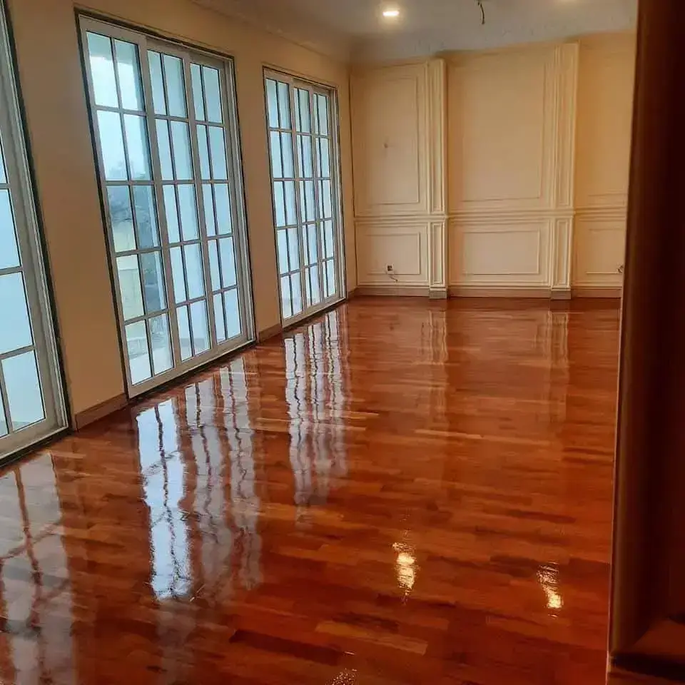 Living room wooden floor sanded and polished by EVA Wood Floor Polishing